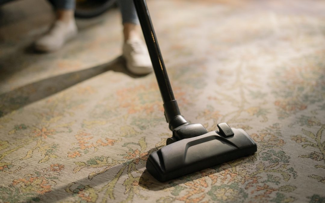 vacuuming the carpet